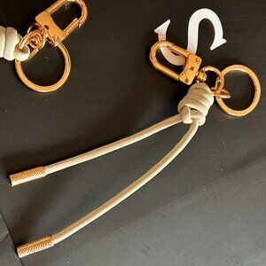 New. Snap Bag Charm. Leather. CREAM & GOLD KeyChain.
